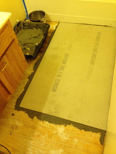 Starting laying the cement board.