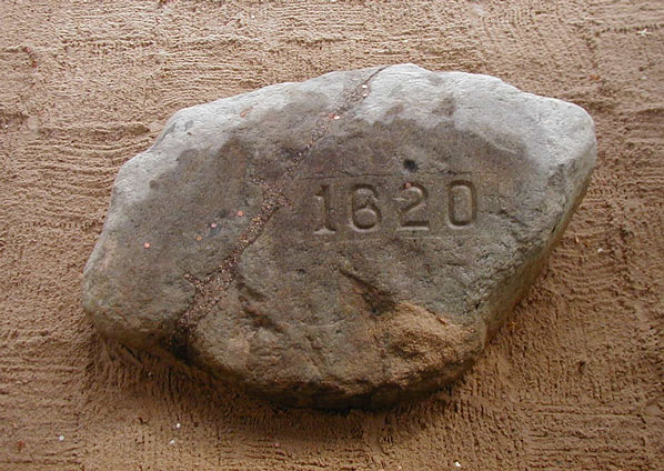 Plymouth rock.  I think it has been whittled down through the years.  It is only a few feet across.