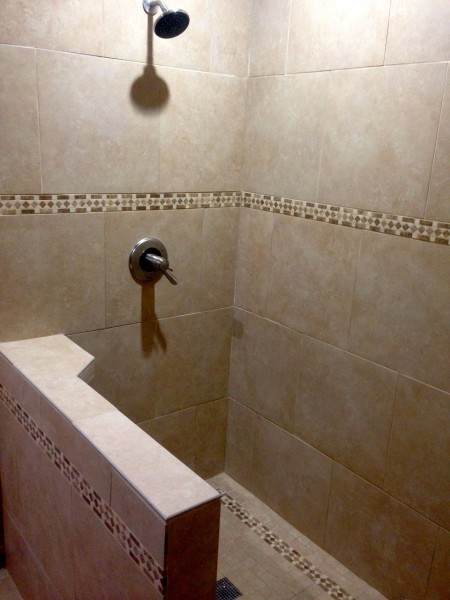 The shower looks pretty good.  Vincent is getting a glass wall and shower door custom made for the exposed side.