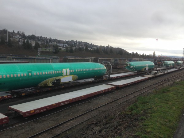 This is the home of Boeing, so I don't know why it surprised me to see air plane fuselages on a train.  