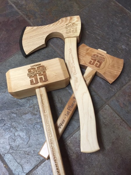 Awards are these custom wood axes and such.