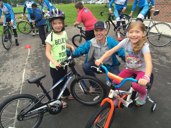 Matt with a couple of the kids that got new bikes.