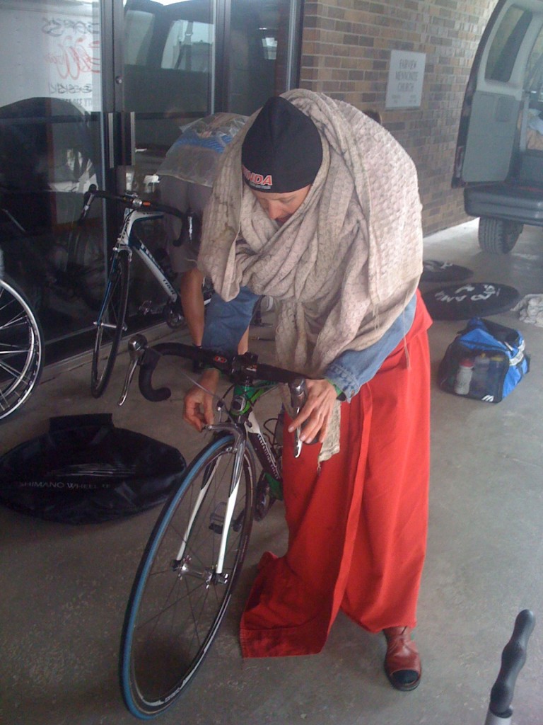 "Bag Lady" Catherine trying to stay warm before the race with bike blankets.
