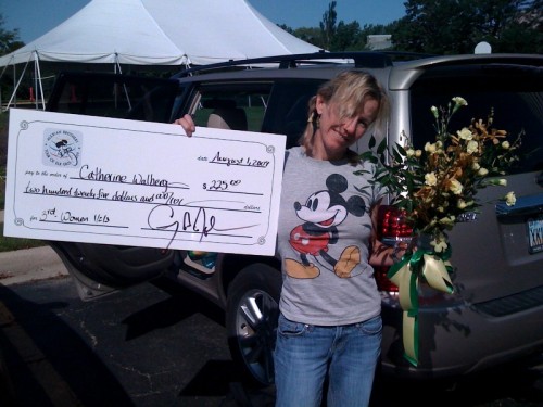 Nicer photo of Catherine with her big size check.