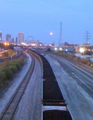 Dusk riding to the race.  Full moon over the tracks.  St. Louis arch in the background.  