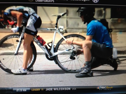 The guy is still trying to put the wheel in with the derailleur in his hand.