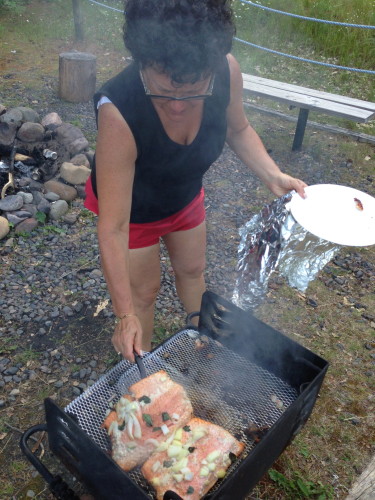 Stacie grilling salmon for dinner.