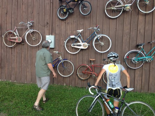 Fatman, Gary Crandall, showing Catherine his old bike collection.