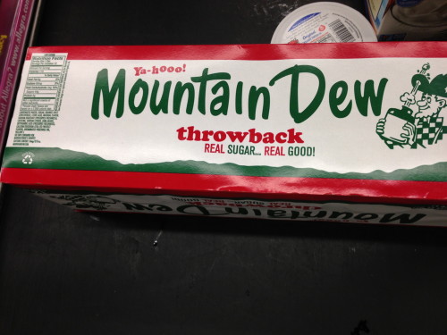 The guy in front of me shopping had this Mt. Dew.  It doesn't have any corn syrup.  It is made with sugar.  I don't know how much it cost, but he said that it wasn't nearly as sweet as normal Mt. Dew.  