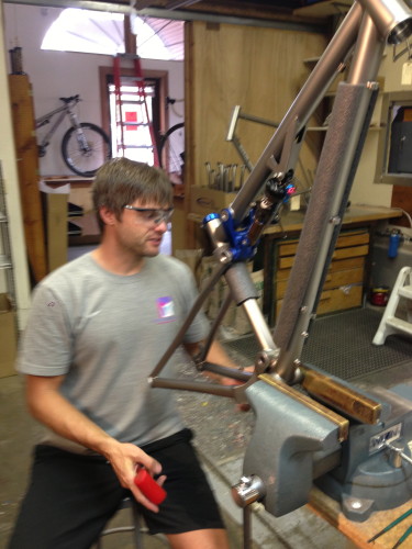 Brad Bingham assembling one of his dual suspension bikes.