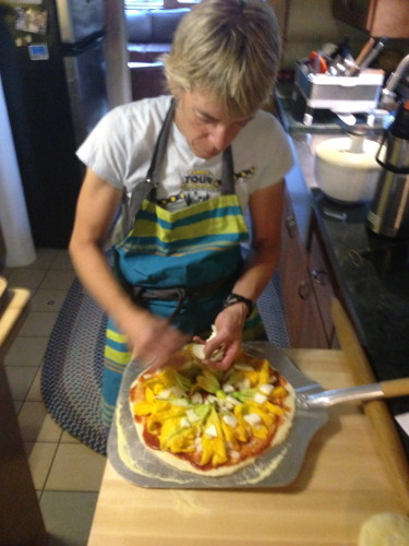 And once again, Katie creating.  This is a squash blossom pizza.  The only other time I have had squash blossom was in San Diego.  They were fried.  I very much doubt I would eat them raw.  I must be a Colorado/California thing.
