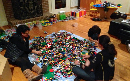 Trudi, Stacie and her son Adam sorting through "a few" legos for Adam's birthday party this weekend.