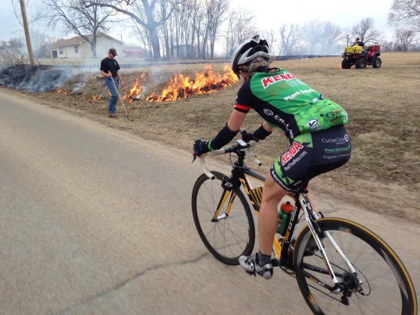 Catherine riding back from the race last weekend and the guy just burning because he can, not for the real reason for burning.