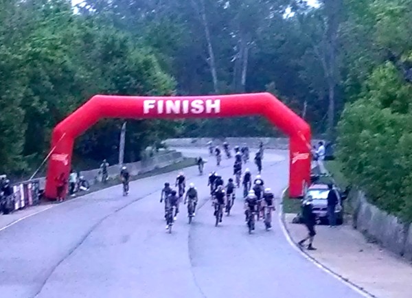 FInish sprint photo.  The line was 10 feet before the banner.  I'm in the middle about 5th, in the white helmet.