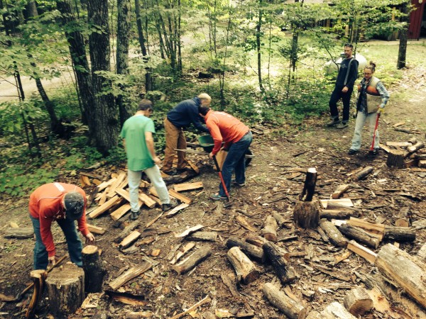 Splitting wood is a communal project after the Fat Tire.