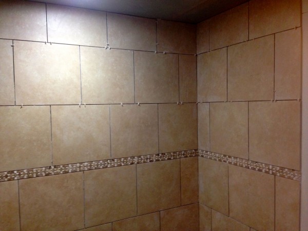 I've never used 18 inch tile on walls.  It looks pretty good.  The shower is huge, with nearly 9 foot ceilings.  