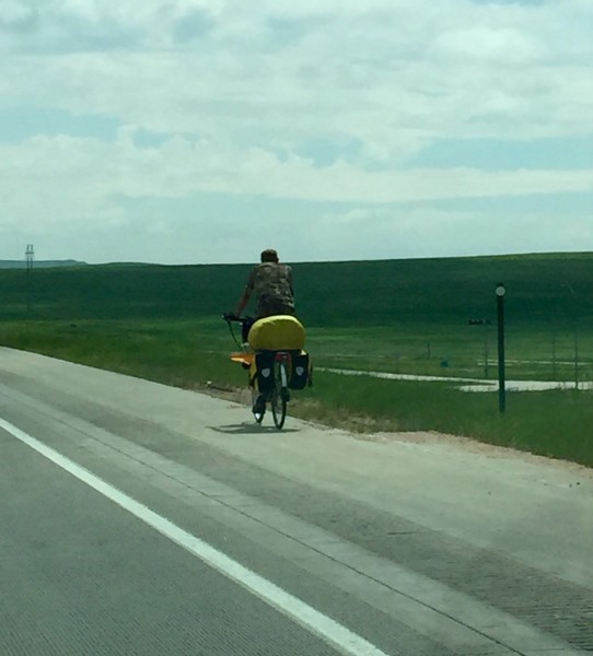 This guy was riding down I-70 outside of Limon, CO.  I saw another cyclist just staying on the shoulder.  Weird, not sure it is legal there to ride bikes, but I might be wrong.