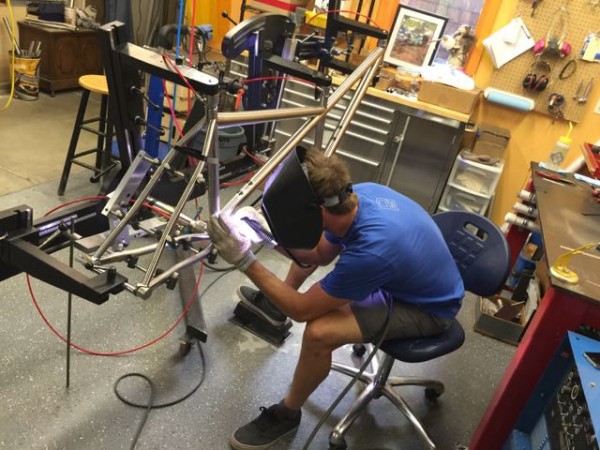 Brad Bingham, who designed the dual suspension bike, doing his thing, welding a tandem frame. The guy is an artist.