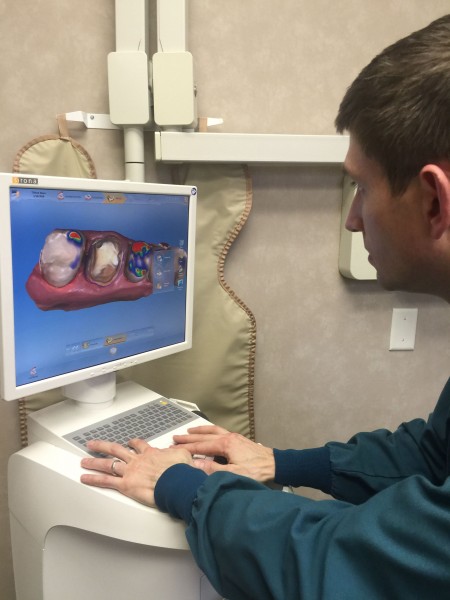 Modern dentistry is super cool. This is Dr. David Gilmer looking at a 3D image he took.