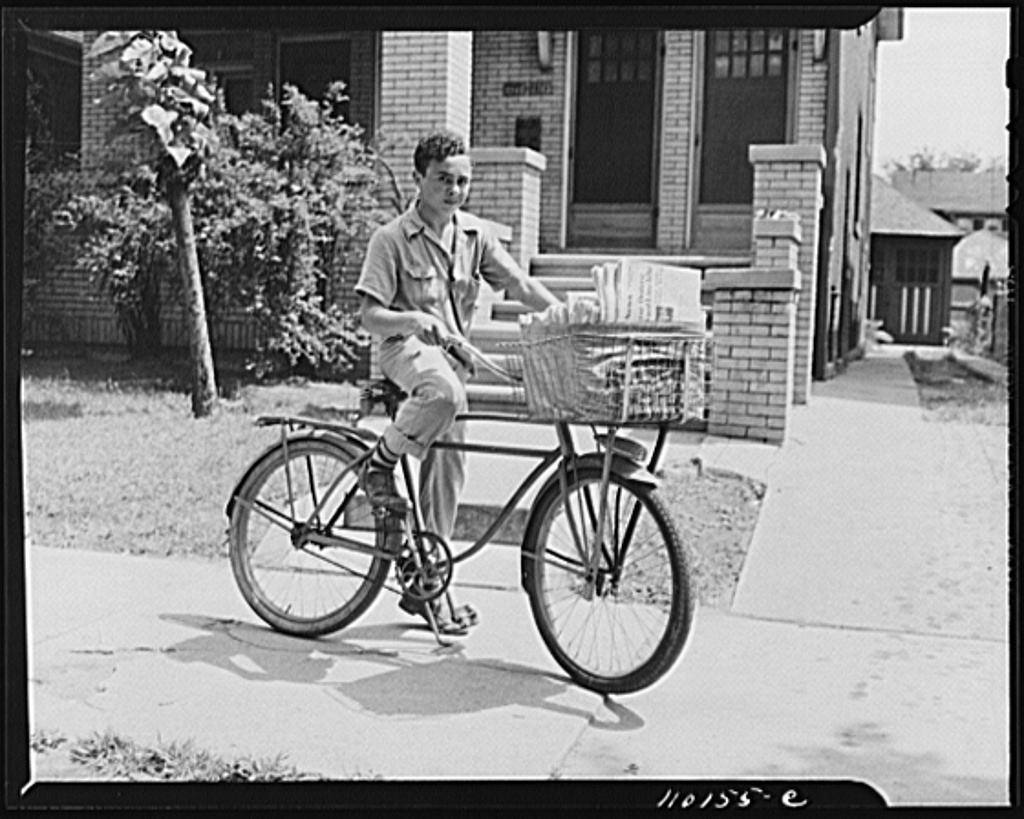 This could have been me, but I was riding a Schwinn Colligate and had baskets on the back too.