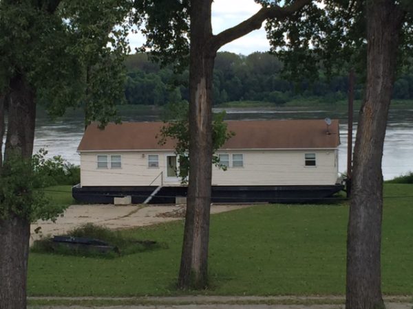 I saw this house by the Mississippi River yesterday out riding. It is build on a boat with poles beside it so it can just raise up when the river floods.