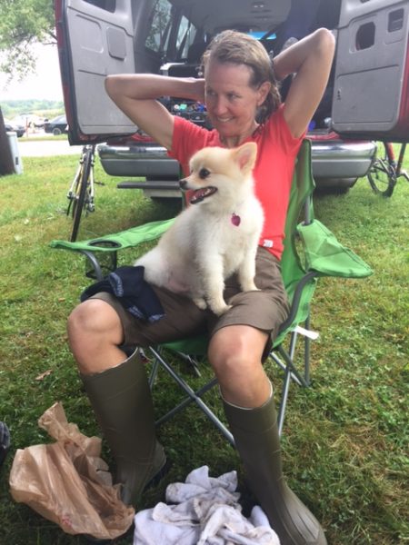 Catherine and their dog, Jason, after her race.