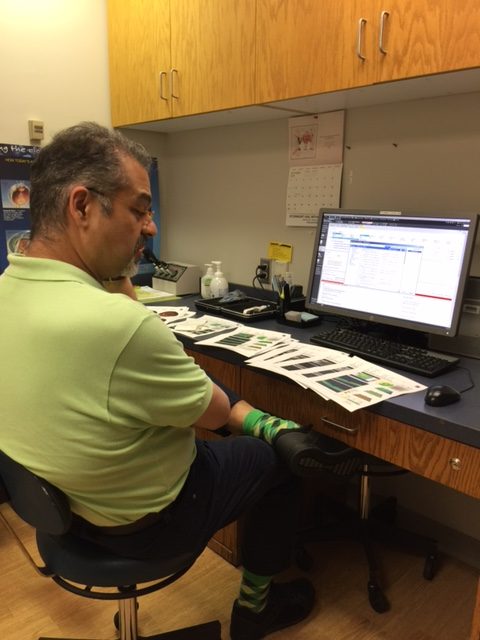 Dr. Marefat looking over all the data he collected. Super good guy.