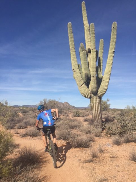 There are lots of cactus around.  Vincent can't seem to keep both hands on the bars much.